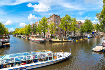 Amsterdam canals and  boats, Holland, Netherlands. - obrazy, fototapety, plakaty