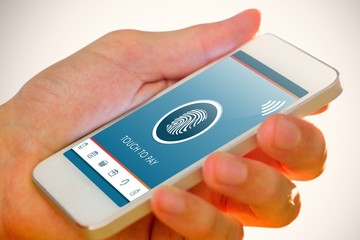 Composite image of hand holding smartphone