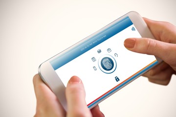 Composite image of hand holding smartphone