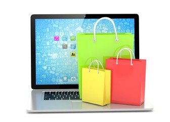 laptop and  shopping pags on white background