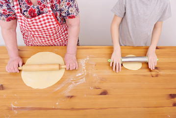 The grandmother and the grandson bake