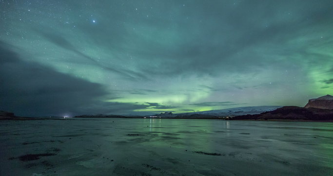 Northern lights on a frozen beach