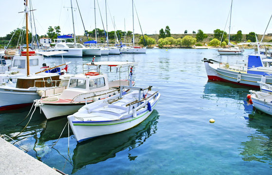 small harbor with boats in Aegean island Greece - fishing boats - transportation icon