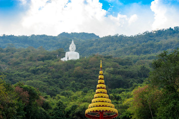 white buddha on peak of monthen