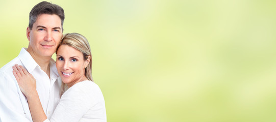 Fototapeta premium Happy loving couple over blue background.
