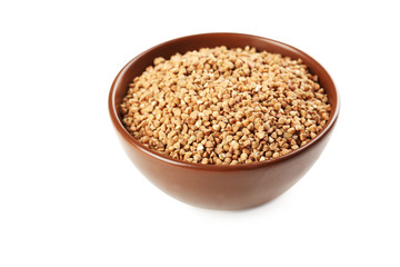 Buckwheat seeds in bowl on a white background