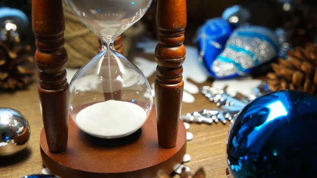 Wooden hourglass measures time till holiday. Slow motion, HD, 720p.