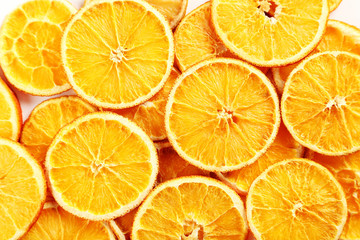 Fototapeta na wymiar Dried orange slices background, close up
