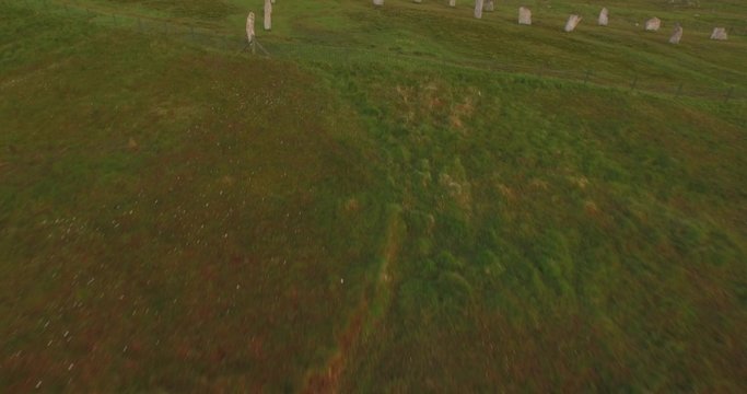 Cinematic aerial shot of Callanish standing stones on the Isle of Lewis, Outer Hebrides, Scotland
