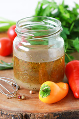 Salad dressing with olive oil, honey, lemon and herbs