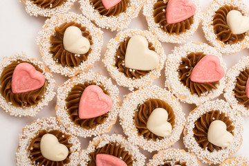 Sweet cupcakes and tartlets. White and pink colours