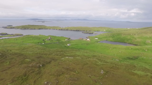 Stunning aerial shot on the Isle of Harris, Scotland near the coast showing water and land
