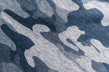 closeup of military uniform surface, abstract background. © tawanlubfah