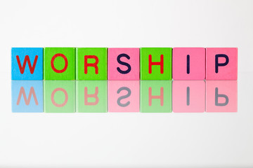 Worship  - an inscription from children's  blocks