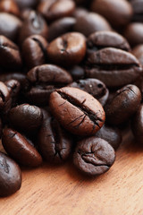 Coffee beans on wood background