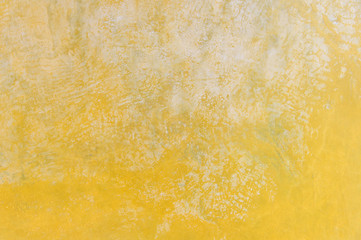 Antique italian yellow plaster texture background