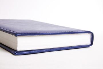 Blue notebook on a white background