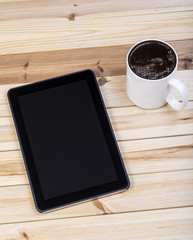Digital Tablet With Coffee On Wooden Table. Top View.