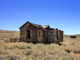 Abandoned farmhouse on prairie on Bodie, California - landscape photo