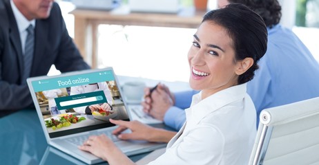 Composite image of business people in discussion in an office