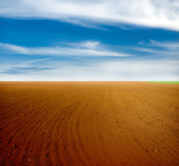 Naklejka premium Plowed field in spring time