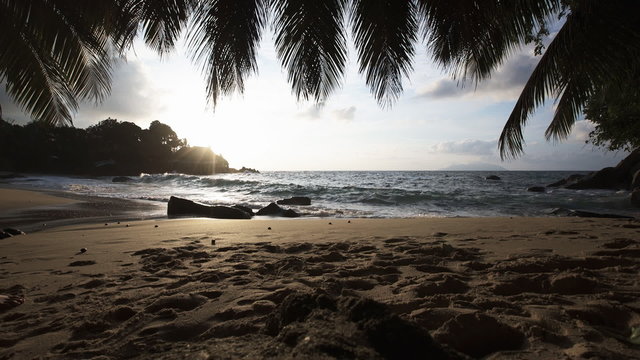 Seychelles beach sunset with blue ocean view