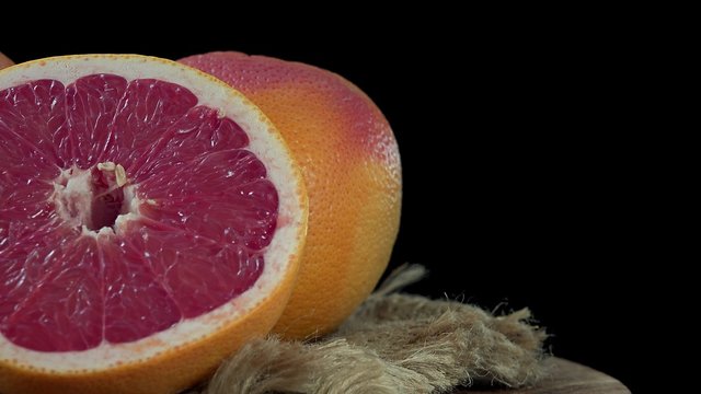 Portion of rotating Grapefruit (seamless loopable 4K footage)
