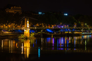 Fototapeta na wymiar Bridge over Rhone river in Lyon, France at night