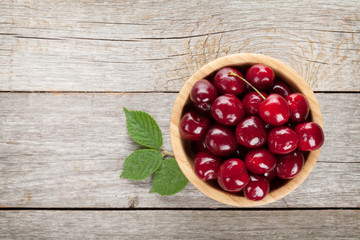 Ripe cherries on wooden table