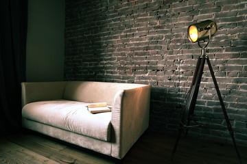 loft with lamp and sofa
