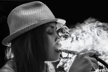 Woman Inhaling from a Hookah