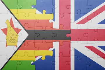 puzzle with the national flag of great britain and zimbabwe