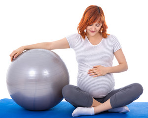 beautiful pregnant woman doing exercises with fitball isolated o