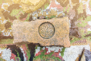 Fototapeta na wymiar The stamp on old baked clay brick