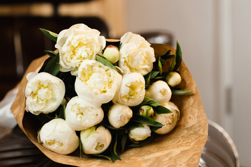 Luxury bouquet of white peonies at interior