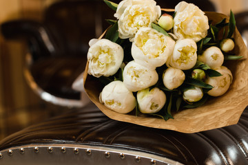 Luxury bouquet of white peonies at interior