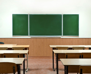  class room with a school board and school desks