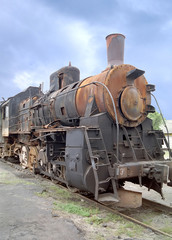 Fototapeta na wymiar an old locomotive stands on a railway way