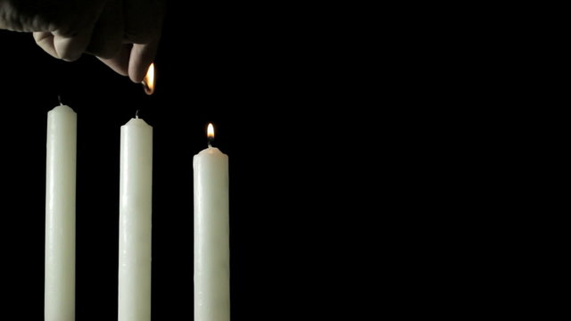White candles on black