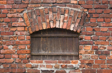 brick wall with a wooden window