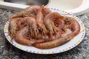 Bowl of uncooked prawns