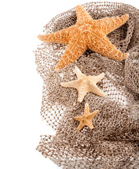 three sea the stars of different sizes lie on the fishing net on