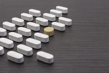 line of aligned pills on the table