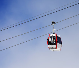 Gondola lift with ski and snowboards