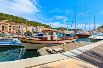 Fishing boat in Bonifacio port on sunny summer day, Corsica island, France