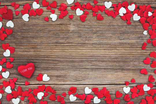 Valentines Day background with red and white hearts. Toned, soft focus 