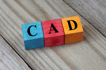 CAD (Canadian Dollar) sign on colorful wooden cubes