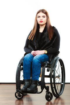 Woman invalid girl on wheelchair