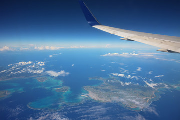 Fototapeta premium airplane above many islands