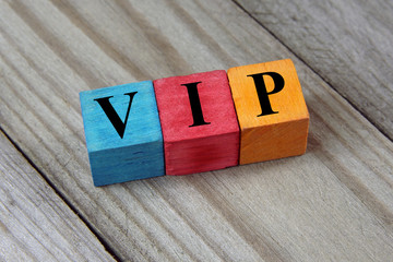 VIP (Very Important Person) text on colorful wooden cubes